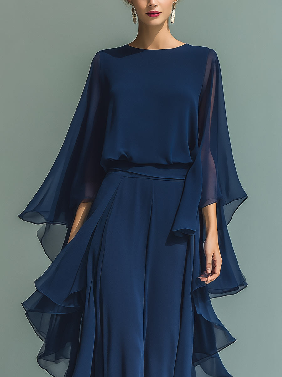 Navy blue chiffon set with delicate ruffles.